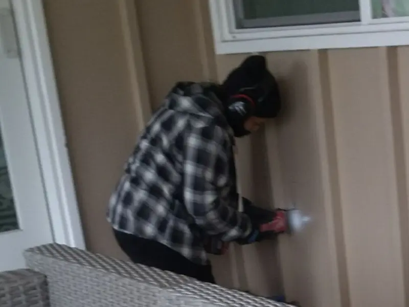 Professional electrician installing an exterior outlet in Carteret